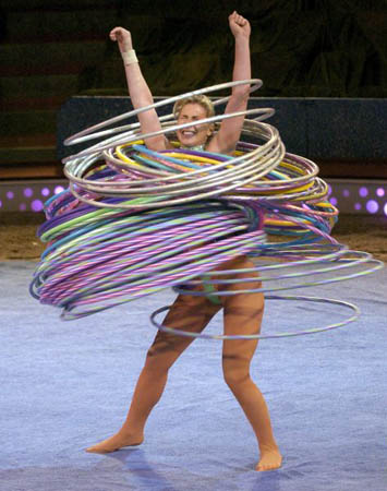 Alesya Goulevich sets a world record in 2004 by spinning 100 hula hoops 
